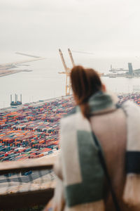 Rear view of woman looking at port