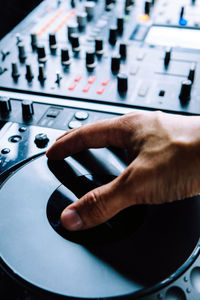 Close-up of hands playing guitar