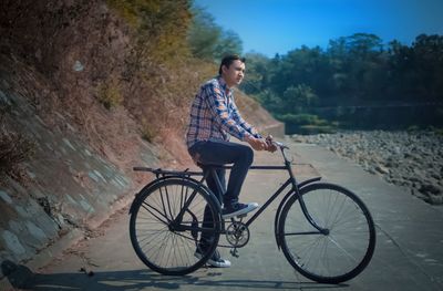 Man riding bicycle on water