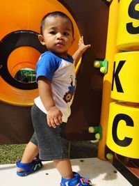 Portrait of baby boy playing at playground