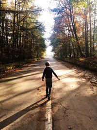 Full length of man walking on road