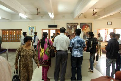 Rear view of people walking in corridor