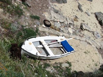 High angle view of abandoned boat moored on shore