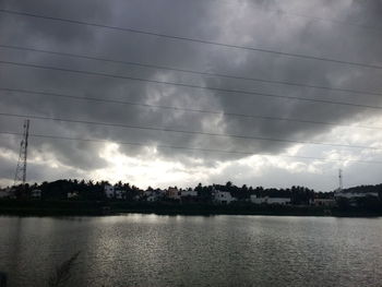 Scenic view of calm sea against cloudy sky