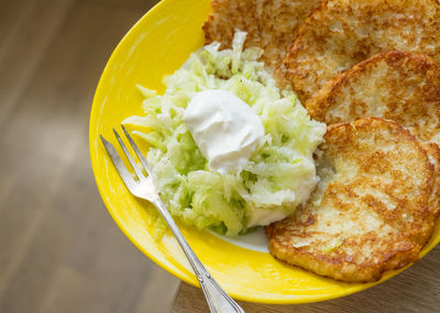 Green radish salad and potato pancakes