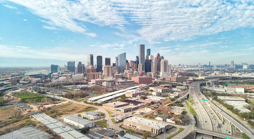 High angle view of buildings in city against sky