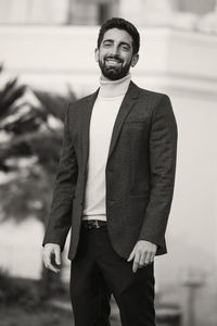 Portrait of a young man standing outdoors