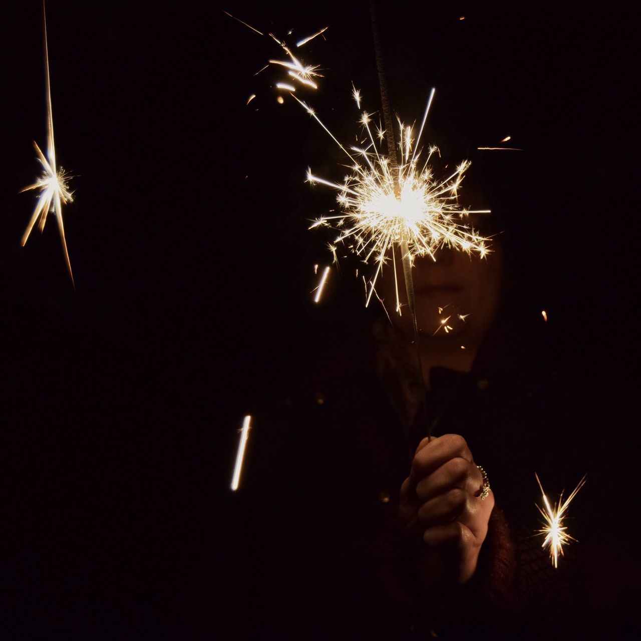 night, illuminated, celebration, firework display, exploding, firework - man made object, glowing, arts culture and entertainment, event, sparks, long exposure, fire - natural phenomenon, motion, firework, entertainment, celebration event, blurred motion, low angle view, smoke - physical structure, burning