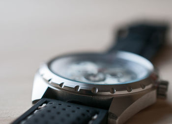 Close-up of wristwatch on table