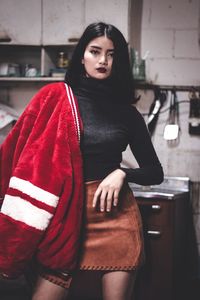 Portrait of beautiful woman standing in office