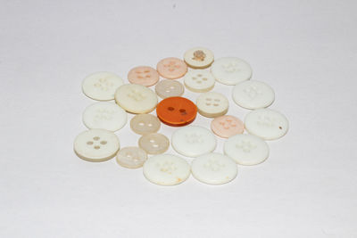 High angle view of coins on white background