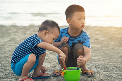 Cute boy playing on beach