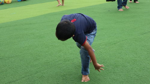 High angle view of people playing on grassland