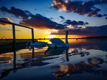 Scenic view of lake against sky during sunset