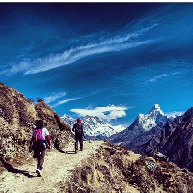 mountain, leisure activity, mountain range, lifestyles, men, full length, sky, tranquil scene, scenics, landscape, hiking, tranquility, beauty in nature, tourist, rear view, blue, tourism, nature, walking