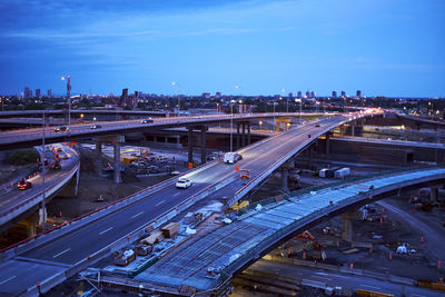 Highway interchange at night with construction in all directions