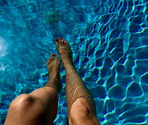 Low section of woman in swimming pool