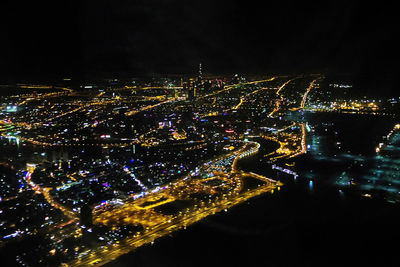 High angle view of illuminated buildings in city at night