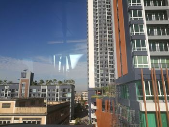 Buildings in city against sky