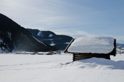 Snow covered mountains against sky