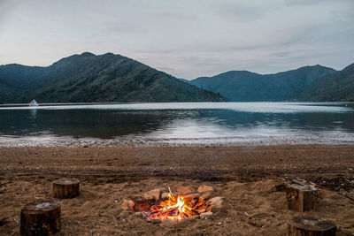 Scenic view of lake against mountain range