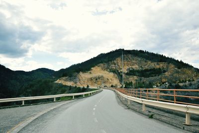 Empty road against sky