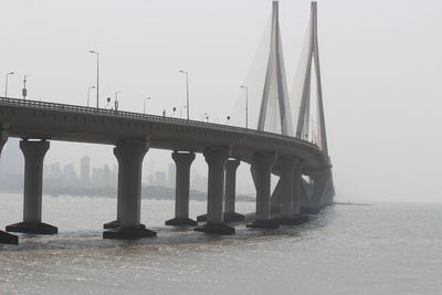 Bridge over river against sky