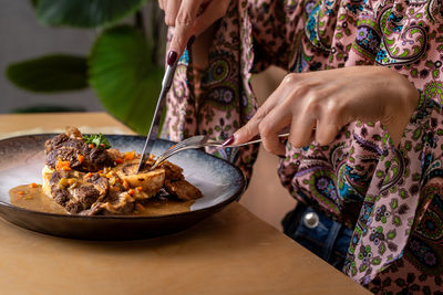 Midsection of woman having food