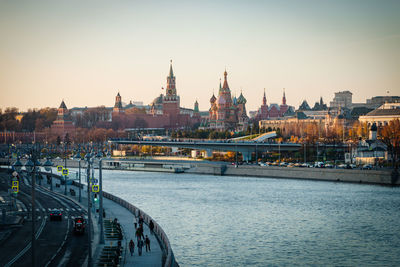 River in city against clear sky