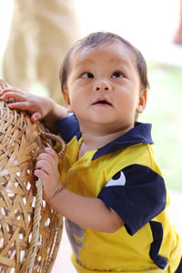 Close-up of cute boy standing outdoors