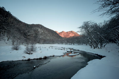 Oku-nikko in winter, mountains reflected in the sunrise