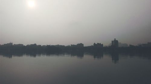 Scenic view of river at sunset