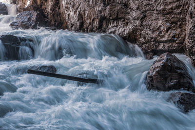 Scenic view of waterfall in sea