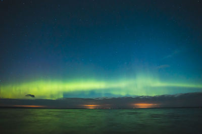 Scenic view of sea against sky at night