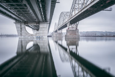 Low angle view of bridge over seascape