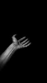 Close-up of man over black background
