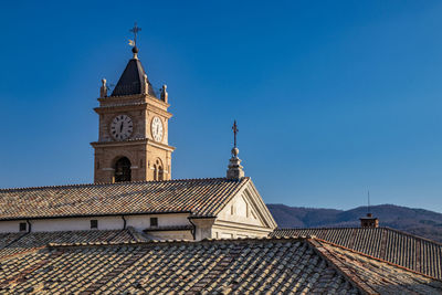 Low angle view of building against blue sky