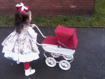 Rear view of girl with umbrella