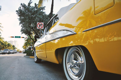 View of yellow car on street