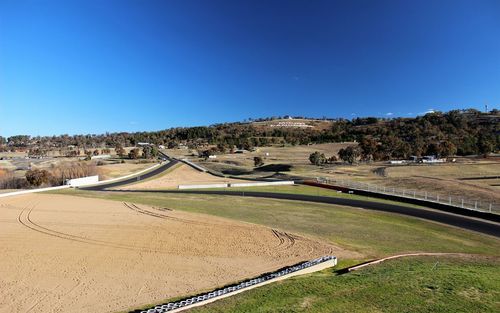 Panoramic view of landscape against clear blue sky