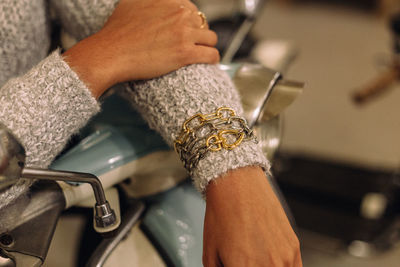Close-up of woman holding hands at home