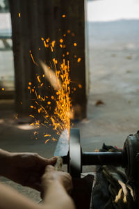 Close-up of hand grinding a handmade knife