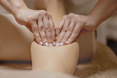 Midsection of woman doing therapy at spa