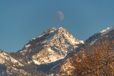 Moon over the mountain peak