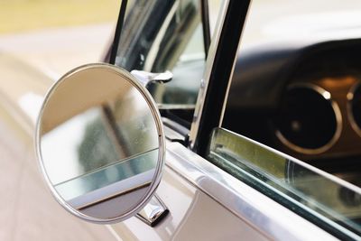 Close-up of side-view mirror of car