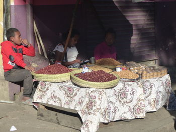 People at market stall