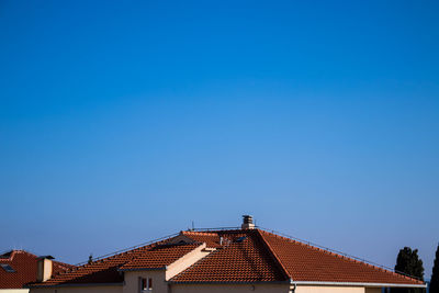 Low angle view of building against blue sky