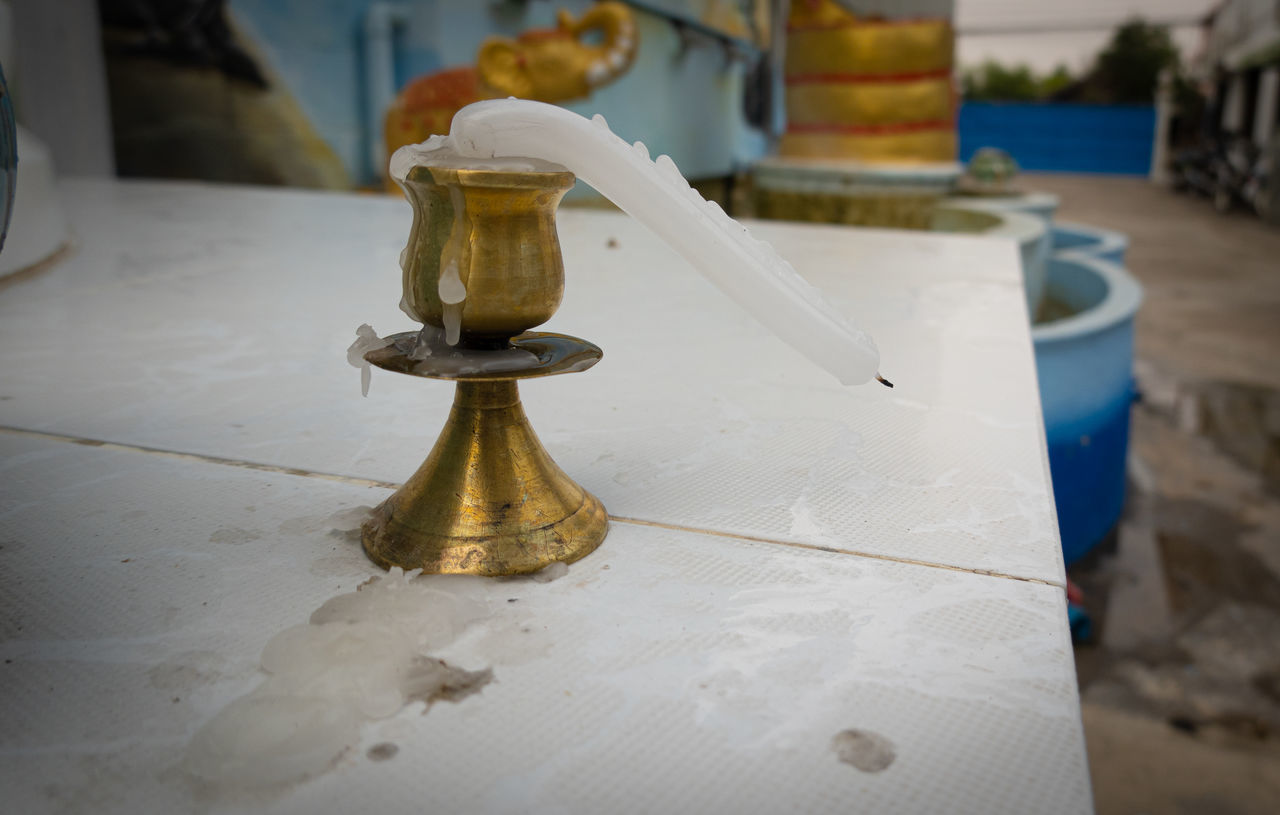 CLOSE-UP OF OLD FASHIONED AND WHITE TABLE