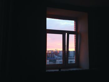 View of cityscape through window