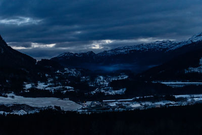 Scenic view of snowcapped mountains against sky